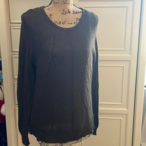 Olive green sweater with sheer printed insert detailed hem.